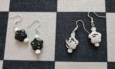 Splatter bead earrings in monochrome  Each one is a flower with mother of pearl beads  On silver hooks White Flower Shape Cluster Earrings, Handmade White Beaded Flower-shaped Earrings, Alt Earrings, White Flower-shaped Earrings With Pearl Charm, White Cluster Flower-shaped Earrings, White Flower Earrings, White Mother Of Pearl Flower-shaped Earrings, White Flower Earring, Black And White Flower