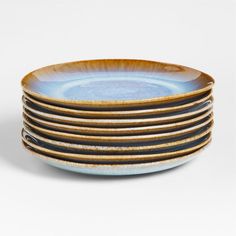 stack of blue and brown plates on white background