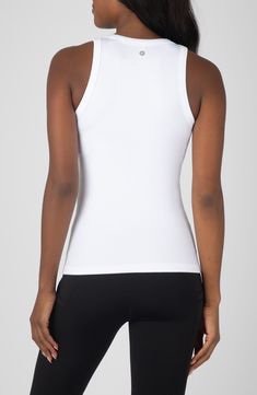 Stock up on essentials with this trio of seamless tank tops crafted from stretchy fabric. Pack of three tank tops Crewneck Sleeveless 92% nylon, 8% spandex Machine wash, tumble dry Imported White Tank Top With Built-in Bra, High Stretch White Tank Top, White High Stretch Racerback Top, Snug Fit Sleeveless Tops With Built-in Bra, White High Stretch Tank Top, White High-stretch Tank Top, White Stretch Racerback Top, Fitted White Racerback Camisole, White Fitted Racerback Camisole