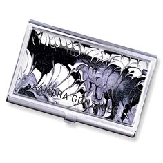 a silver business card case with an image of flowers on the front and back side