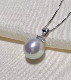 Material : Genuine Solid .925 Sterling Silver OR Gold CZ Size : 7 mm Total Length : 12 mm approx. Quantity : One Piece of Pendant *PEARL & CHAIN NOT INCLUDED* Color : Sterling Silver ; OR Sterling Gold; OR *Remarks : Best for 8-10mm half drilled pearls & beads. Picture shown with pearl & Chain are for reference ONLY. Lead Time & Shipping : We ship your order within 24 hrs. (Monday-Friday) once we received your order. **Express Mail orders received by 12:00 noon (Pacific Time) wil Classic Pearl Pendant Jewelry With Cubic Zirconia, Classic Cubic Zirconia Jewelry With Pearl Pendant, Sterling Silver Necklace With Bail For Anniversary, Silver Pearl Jewelry With Diamond Accents, White Pearl Jewelry With Prong Setting, Pearl Jewelry With Diamond Accents For Gift, Pearl Jewelry With Diamond Accents As A Gift, Aaa Quality Sterling Silver Jewelry For Anniversary, Silver Necklace With Bail In Fine Jewelry Style