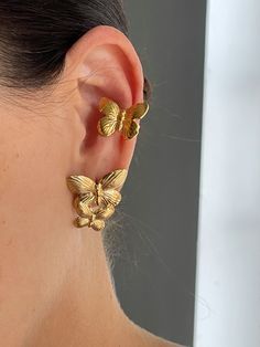 Elevate your style with The Butterfly Earcuff! Crafted from durable stainless steel and gold plating, this unique earcuff features a delicate butterfly shape that adds a touch of whimsy to any outfit. Make a bold statement and stand out from the crowd with this must-have accessory. Luxury Gold Plated Elegant Ear Cuff, Ear Cuffs Butterfly, Indian Earcuffs, Fine Jewelry Butterfly Shaped For Pierced Ears, Earcuffs Earrings, Butterfly Earrings With Ear Cuff, Butterfly Accessories, Exclusive Earrings, Delicate Butterfly