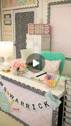 a desk with many items on it and a lamp in front of the desk that says mrs warrick