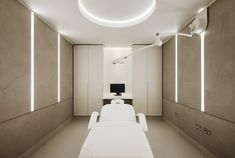 a white room with two beds and a tv on the wall in front of it