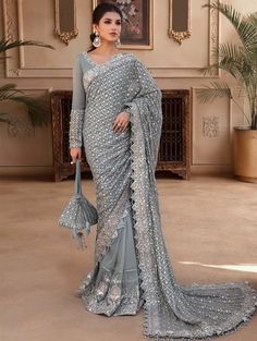 This beautifully crafted by Maria B Mbroidered Saree is perfect for formal or special occasions. Featuring intricate mbroidery and unique designs, it combines comfort and style to provide you with a one-of-a-kind look. Brand : Maria B Mbroidered Code :  Blue (BD-2602) Fabric Details: Embroidered Organza Sleeve Patti with Hand Embellishment Embroidered Organza Allover Pallu Patti Embroidered Organza Saari Fall Patti Embroidered Organza Neckline with Hand Embellishment Embroidered Pure Chiffon Saa Petty Coat, Pakistani Mehndi Dress, Pakistani Bridal Dress, Mehndi Dress, Organza Sleeves, Embroidered Organza, Pure Chiffon, Maria B, Party Kleidung