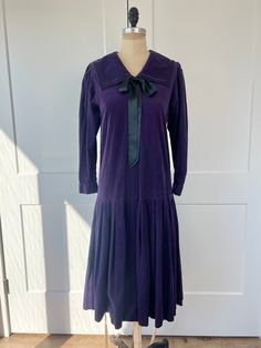 "Vintage 1980s purple corduroy Laura Ashley, dropwaist pleated midi dress with square sailor collar & bow around the neckline. In very good vintage condition, mending present on side. B: 36\" W: 36\" L: 38\" Recommended for US 4/6" Eccentric Outfits, Floral Lace Maxi Dress, Sailor Dress, Striped Long Sleeve Tee, 1980s Dresses, Sailor Collar, 80s Dress, Pleated Midi Dress, 1960s Fashion