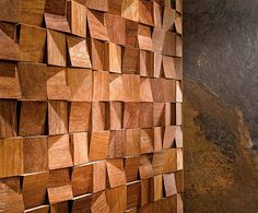 a wall made out of wooden blocks in a room