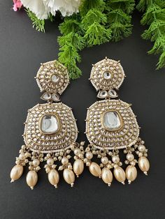 Lightweight  earrings.  Earrings length- 3.5 inches Kundan Pearl Earrings With Stone Work For Festivals, Heavy Pearl Drop Earrings For Festivals, Heavy Drop Pearl Earrings For Festivals, Kundan Meenakari Dangle Pearl Earrings, Kundan Stone Work Earrings For Diwali, Festive Heavy Pearl Drop Earrings, Handmade Kundan Earrings For Wedding, Diwali Stone Work Danglers Drop Earrings, Bollywood Heavy Chandbalis Drop Earrings