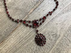 Antique Garnet Necklace, Victorian Bohemian, Deep Color, Period Jewelry, KH - Etsy Polska Antique Garnet Necklace, Bohemian Garnet Necklace, Antique Garnet Pendant Necklace, Victorian Garnet Necklace, Victorian Jeweled Necklaces, Vintage Garnet Gemstone Necklace, Vintage Round Necklaces With Stones, Victorian Round Necklace With Jewels, Faceted Pendant Necklace For Wedding