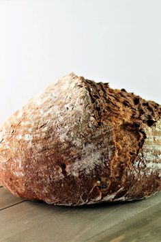 a loaf of bread sitting on top of a wooden table