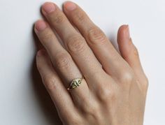 a woman's hand with a ring on it