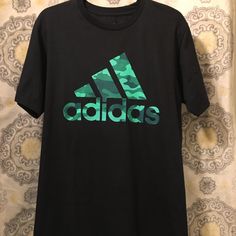 Adidas Tee Shirt Adidas Camo Logo New And Never Used Adidas Green Sports T-shirt, Adidas Green T-shirt For Sports, Casual Green Adidas T-shirt, Casual Green Adidas Tops, Adidas Green Cotton T-shirt, Adidas Crew Neck Shirt With Letter Print, Green Adidas Cotton T-shirt, Adidas Sporty Shirt With Letter Print, Adidas Green Short Sleeve T-shirt