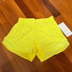 New With Tag Lululemon Hotty Hot Hr Short 4" *Lined Size 6 Electric Lemon 100% Authentic ***The Pictures Were Taken With The Actual Shorts*** Very Clean, Smoke-Free And Pet-Free Environment Nylon Shorts For Light Exercise In Summer, Yellow Go-dry Workout Shorts, Yellow Running Shorts With Go-dry Technology, Yellow Summer Athletic Shorts For Training, Yellow Running Shorts With Go-dry, Yellow Nylon Sports Shorts, Yellow Athletic Shorts For Summer Training, Yellow Bottoms For Summer Running, Yellow Sporty Activewear For Beach