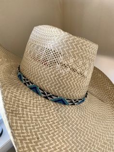 "1/2\" wide All bead work is beaded with 10lb extreme braided nylon line. All hat bands are finished at 23\" with glued than sewed down leather ends and an adjustable leather tie." Western Blue Sun Hat With Flat Brim, Western Style Blue Sun Hat With Flat Brim, Western Blue Hat Bands For Ranch, Western Blue Hat Bands For Country Events, Blue Western Straw Hat For Country Events, Western Blue Straw Hat For Country Events, Blue Country Hat Bands For Western-themed Events, Adjustable Braided Hat For Rodeo, Adjustable Blue Hat For Country Events