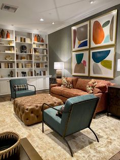 a living room filled with furniture and bookshelves