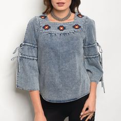 3/4 Sleeve Denim Top With A Square Neckline And Wide Sleeves, Featuring Floral Embroidery. Fabric Content: 70% Cotton 27% Polyester 3% Spandex Description For Small: L: 24" B: 30" W: 32" Blue Denim Top With Floral Embroidery For Spring, Blue Denim Top With Floral Embroidery, Light Wash Denim Tops With Floral Embroidery, Blue Denim Tops With Floral Embroidery, Stretch Denim Blue Top For Spring, Stretch Washed Blue Tops For Spring, Spring Stretch Denim Top, Stretch Dark Wash Denim Top For Spring, Medium Wash Floral Embroidery Tops For Spring