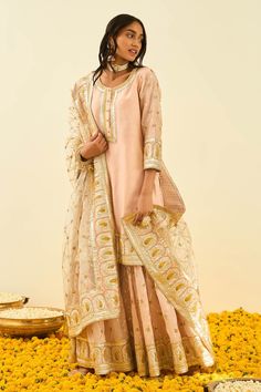 Rose pink short kurta with gota patti work and highlighted with basra moti. Paired with embroidered gharara and silk organza daisy ivory dupatta.
Component: 3
Pattern: Embroidered
Type Of Work: Floral, Paisley
Neckline: Round
Sleeve Type: Long Sleeves
Fabric: Kurta and Gharara - Silk Chanderi; Dupatta - Silk Organza
Color: Pink
Other Details: 
Gota and bead work
Embroidered dupatta
Occasion: Wedding,Mehendi - Aza Fashions Ivory Dupatta, Wedding Mehendi, Chanderi Dupatta, Pink Kurta, Short Kurta, Embroidered Dupatta, Silk Organza, Pink Shorts, Set For Women