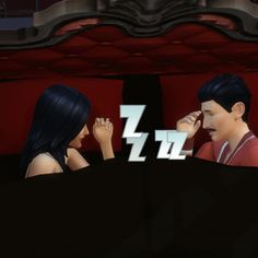 two people sitting next to each other in front of a red couch with the letters zzzzz on it