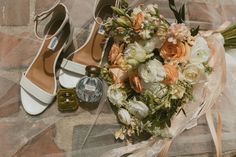 wedding bouquet and shoes on the ground