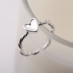 Add a touch of glamour to your look with this Twisted Knitting Heart Adjustable Plain Ring. Crafted from high-quality material, this ring features an adjustable fit for all sizes. The elegant heart design is sure to turn heads and add a touch of style to any outfit. Product Details Material: 925 Silver Color: White Gold Plated Size: US Size #8 Adjustable Weight: about 2.4g SKU: AR23101931 Product Keywords: Distorted band rings, Avante-garde rings, Unique shaped rings, vintage rings, vintage band Knitting Heart, Plain Ring, Plain Rings, Knitted Heart, Blood Diamond, Vintage Band, Ring Vintage, Pita, Heart Design