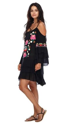 FROM THE BEACH TO THE DINNER TABLE, this embroidered dress will turn heads. This cold shoulder dress is made of soft, comfortable rayon. This fiesta tunic has a short length. This summer dress stops right above the knee. Wear this floral dress with a slip or matching nude underwear for a night on the town. Toss this bali dress over your favorite swimsuit for the pool. Wear this boho tunic top with shorts or leggings. You’ll grab this house dress over and over again. FLORAL EMBROIDERY AND RUFFLES Off-shoulder Embroidered Spring Dress, Floral Embroidered Off-shoulder Dress, Spring Beach Black Embroidered Dress, Black Embroidered Beach Dress For Spring, Spring Beach Embroidered Black Dress, Floral Embroidered Mini Dress For Vacation, Black Folk Style Summer Dress, Vacation Mini Embroidered Dress With Floral Details, Summer Floral Embroidered Off-shoulder Dress