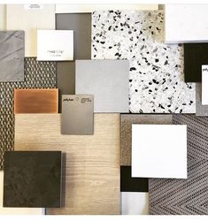 many different colors and shapes of tile on the floor with white, black, gray, and brown tiles