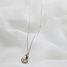 "A bridal silver necklace with a dainty CZ teardrop centerpiece. This romantic necklace features a NICKEL FREE high-quality silver-coated Swarovski teardrop crystal minimalist pendant with a silver necklace. This delicate necklace is perfect for a boho bride or bridesmaid who is looking for a stylish and classic look. You can choose your desired finish - Gold, Rose gold or Silver This necklace will compliment most kinds of brides dress tops, and can also be used on special occasions. Get this ne Silver Teardrop Pendant Crystal Necklace With Clavicle Chain, Silver Crystal Teardrop Pendant Necklace With Clavicle Chain, Elegant Teardrop Clavicle Crystal Necklaces, Elegant Teardrop Crystal Clavicle Necklace, Elegant Teardrop Crystal Necklace With Clavicle Chain, Silver Pear-shaped Solitaire Necklace For Wedding, Pear-shaped Silver Solitaire Necklace For Wedding, Silver Crystal Teardrop Pendant Necklace, Delicate Silver Teardrop Pendant Necklace