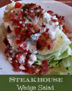 a white plate topped with lettuce and bacon covered wedges next to a fork