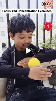 a young boy is holding an orange in his hand and looking at it with the caption focus and concentration exercises