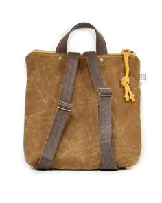 a small brown bag with handles and straps