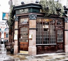 an old building with ivy growing on the outside