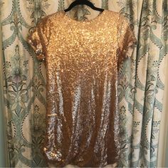 Beautiful T-Shirt Style Gold Sequin Dress By Pink Lily, Perfect For Your Holiday Party! New Without Tags. Spring Party Dress With Crew Neck, Festive Short Sleeve Mini Dress For Summer, Fitted Sequin Dress With Crew Neck, Short Sleeve Dresses For Spring Celebration, Short Sleeve Mini Dress For Holiday Party, Short Gold Slip Dress, Gold Sequin Tank Dress, Gold Tutu Dress With Sequins For Dress-up, Champagne V-neck Mini Dress With Sequins