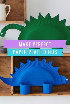 paper plate dinos are displayed on wooden shelves