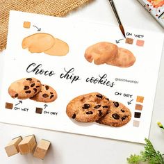 an image of cookies and chocolate chip cookies on a white table with paintbrushes