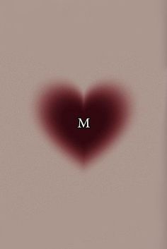 a heart shaped object with the letter m on it