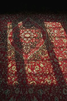 the shadow of a rug is cast on the floor with it's bright light