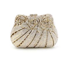 Description: The BELLA Rose Clutch is an elegant statement accessory. Crafted with beautiful gold crystal, this chic clutch is sophisticated and luxurious. Perfect for any evening occasion, this clutch will add an elevated touch to your look. Lining Material: Synthetic Leather Detachable Chain Included Approximate Size: 17-1/2cm (L) x 5cm (W) x 10cm (H) Handmade Clutch Purse, Rose Clutch, Evening Clutches, Floral Clutches, Rhinestone Clutch, Handmade Clutch, Crystal Clutch, Wedding Purse, Party Clutch