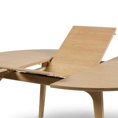 a wooden table with an open laptop on it's back end and two legs