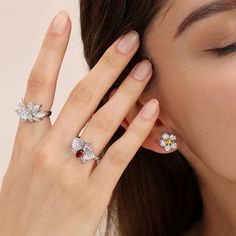 This finely crafted ring showcases a delicate Phalaenopsis orchid design, gracefully adorned with numerous small, sparkling stones. The intricate detailing of the orchid petals adds a touch of botanical elegance to the timeless allure of silver. Each tiny stone reflects light with a mesmerizing brilliance, creating a dazzling display that is sure to turn heads. Elevate your style with the Silver Phalaenopsis Sparkle Ring – a symbol of floral finesse and enduring beauty.Carat Weight: 0.62 ctStone Cubic Zirconia Flower Ring In Fine Jewelry Style, Cubic Zirconia Flower Shaped Fine Jewelry Ring, Cubic Zirconia Flower Ring Fine Jewelry, Luxury Cubic Zirconia Flower Ring, Oval Flower Ring For Wedding, Elegant Diamond Butterfly Ring With Gemstone, Elegant Butterfly Diamond Ring With Gemstone, Oval Diamond Flower Ring, Elegant Orchid Flower Jewelry