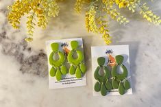 Add a vibrant touch to any outfit with our lightweight Green Dangles. These earrings come in both lime green and olive green, adding a pop of color to your style. With a classy and elegant Moroccan design, you can easily dress up or down with these versatile dangles. Each pair is a one-of-a-kind. Due to the handmade nature of the product, there might be slight variations in pattern, color, or shape compared to the featured photo. All earrings are lightweight and weigh less than a quarter (coin). Modern Green Drop Earrings, Trendy Green Drop Earrings, Green Earrings For Everyday, Modern Green Dangle Earrings, Green Summer Earrings For Everyday Wear, Green Everyday Earrings For Summer, Trendy Handmade Green Earrings, Green Everyday Earrings, Summer Green Hypoallergenic Earrings