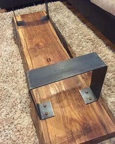 a wooden sled sitting on top of a carpet covered floor