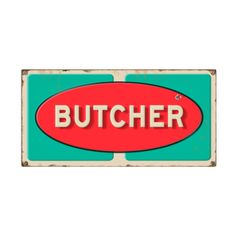 a red and green sign that says butcher on the front, with an arrow pointing to it