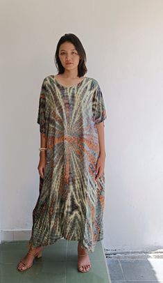 Matahari Kaftan Dress Made with lightweight and breathable rayon, loose and easy fit with an eye catching color blocking, this kaftan perfect for every occasion.  ◇ Color - Tie dye - green and brown ◇ Size One size lenght : 116 cm/ 45.6 inch chest : 166cm/ 65,3 inch US Women size from S To XXL (small to plus size ) ◇ Nagia style model  Her height is 170 cm  Weight is 50 cm  Made from soft rayon Hand cool wash At first, you may smell the unique print and dye. It will disappear after you wash it. Hippie Beach Cover-up Dress With Kimono Sleeves, Multicolor Printed Boho Dress With Short Sleeves, Casual Flowy Kaftan With Short Sleeves, Multicolor Casual Tunic Beach Dress, Casual Multicolor Tunic Beach Dress, Casual Flowy Short Sleeve Kaftan, Casual Short Sleeve Flowy Kaftan, Multicolor Short Sleeve Printed Boho Dress, Multicolor Relaxed Fit Maxi Dress For Summer