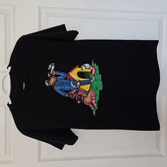 For Skateboard Or Snoop Dog Lovers. Or Both. Some May Say Its In Poor Taste, Some May Think Its Dope. Huf Skate Brand And Snoop Dog Collab On This Wild Graphic Tee. Very Colorful Graphic, Great Condition. Never Worn. Size S Pit To Pit: 18in Length: 25.5in Black Crew Neck Top For Skateboarding, Casual Graphic Print Tops For Skateboarding, Casual Skateboarding Top With Front Print, Casual Tops With Front Print For Skateboarding, Casual Front Print Tops For Skateboarding, Urban Crew Neck T-shirt With Cartoon Print, Fun Cartoon Print T-shirt For Streetwear, Black Graphic Tee For Skateboarding, Urban Cartoon Print Crew Neck T-shirt