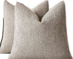 two gray pillows sitting next to each other