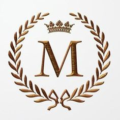 the letter m is surrounded by a crown