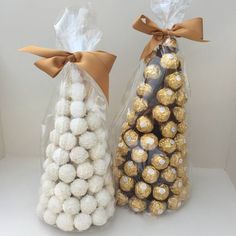 two bags filled with white and gold chocolates