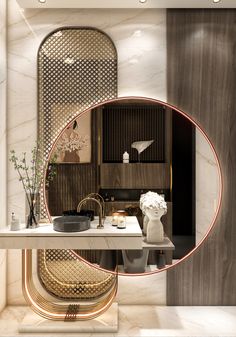 the bathroom is decorated in gold and white with an oval mirror on the wall above it