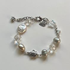 "Handmade Pearl bracelet ✿ Made with glass beads, glass crystal beads, freshwater pearls, and metal accents ✿ Silver, sea-foam green tinted pearl, pearliest white, and iridescent clear ✿ the bracelet has 1.75\" of extension chain. If you'd like a shorter or longer length, select your preferred length. Some beads may be added or removed. The bracelet in pictures 5-7 is a previous version." Funky Jewelry, Beaded Bracelets Diy, Girly Jewelry, Dream Jewelry, Jewelry Inspo, Glass Crystal