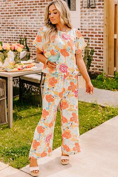 Introducing our Orange Vibrant Floral Printed Short Sleeve Top 2 Piece Pants Set. Expertly designed with a vibrant floral print, this set offers a stylish and versatile addition to your wardrobe. Made with high-quality material, it provides comfort and effortless style for any occasion. Upgrade your look with this must-have set. Size Chart (CM) Sizes Bust Waist Hem_Width Sleeve_Length Length Hip Bottoms Inseam Outseam Relax Relax Relax Relax Relax Relax Relax Relax Relax S 111 67 112 28.9 62 104 Multicolor Floral Print Relaxed Fit Sets, Multicolor Floral Print Bottoms For Brunch, Casual Floral Print Wide Leg Set, Relaxed Fit Multicolor Floral Print Sets, Casual Wide Leg Sets With Floral Print, Spring Brunch Sets With Floral Print, Orange Floral Print Sets For Spring, Orange Floral Print Spring Sets, Spring Floral Print Orange Sets